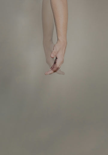 persons hand with pink manicure