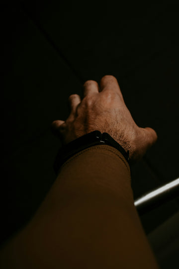 a person holding a cell phone in their hand